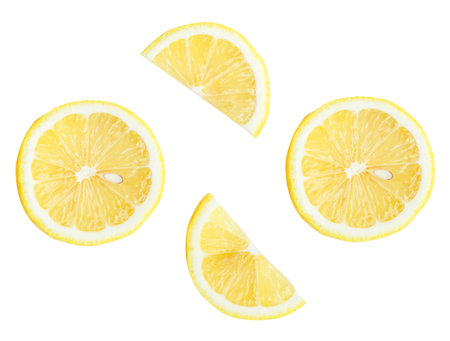 Top view set of fresh ripe yellow lemon fruits in halves and slices or quarters is isolated on white background with clipping path.の写真素材