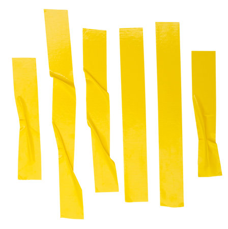Top view set of wrinkled or crumpled yellow adhesive vinyl tape or cloth tape in stripes shape in vertical is isolated on white background with clipping path.の写真素材
