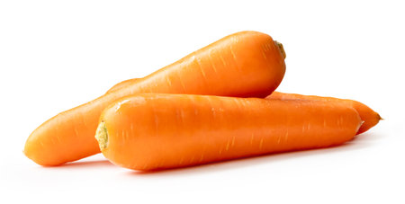 Side view of three fresh orange carrot roots in stack is isolated on white background with clipping path.の写真素材