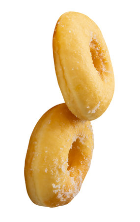 Side view of two brown sugar glazed cinnamon donuts in stack is isolated on white background with clipping path.の写真素材