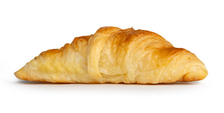 Side view of single brown or golden croissant is isolated on white background with clipping path.の写真素材