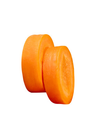 Side view of orange carrot slices in stack is isolated on white background with clipping path.の写真素材
