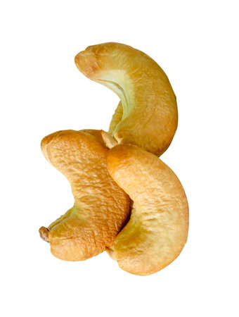 Roasted peeled cashew nuts in stack are isolated on white background with clipping path.の写真素材