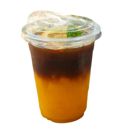 Iced lemon tea in transparent plastic glass is isolated on white background.の写真素材