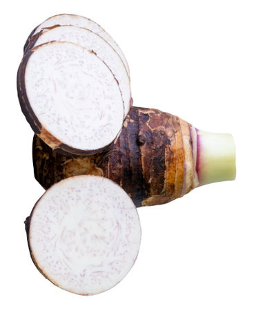 A tuber of taro with circle slices in stack is isolated on white background with clipping path.の写真素材