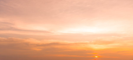Beautiful morning or evening red or orange sky with cloudy while sunsets or sunrises was taken at the sea used as natural background textureの写真素材