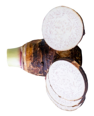 A tuber of taro with circle slices in stack is isolated on white background with clipping path.の写真素材