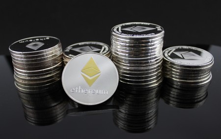 Ethereum ETH Cryptocurrency - Stacks of crypto coins backgroundのeditorial素材