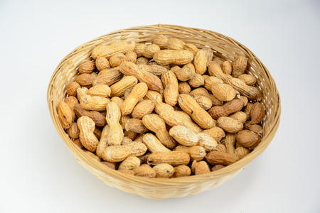 Light Room shooting bamboo basket full of peanutの写真素材