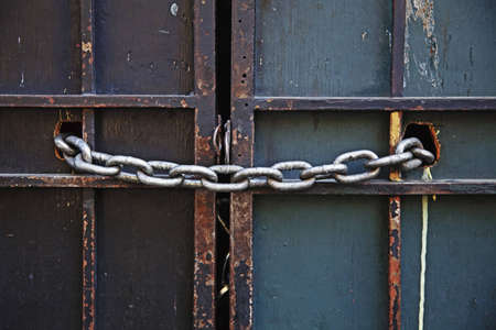 chain keeping wooden doors lockedの写真素材