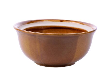 Empty brown  ceramic bowl isolated on white backgroundの写真素材