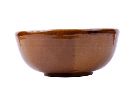 Empty brown  ceramic bowl isolated on white backgroundの写真素材