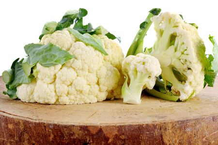 fresh cauliflower  isolated on woodenの写真素材
