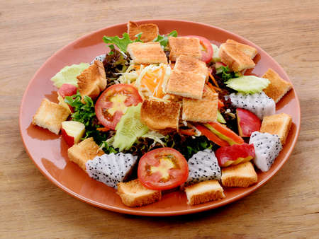 vegetable salad on wooden backgroundの写真素材