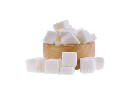 sugar cube in wooden bowl isolated on white backgroundの写真素材