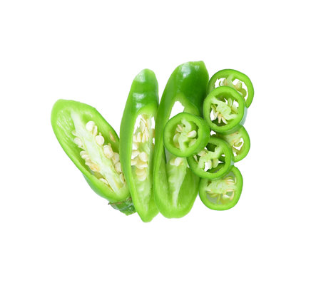 Slices green hot chili pepper isolated on white backgroundの写真素材