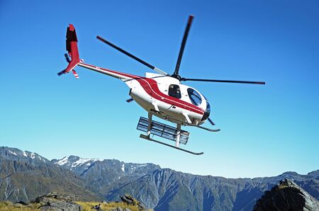 Helicopter in mountainsの写真素材