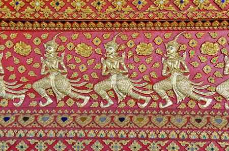 Thai art on the wall designed at Thai templeの写真素材