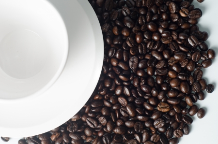 Cup of coffee with bean on white backgroundの写真素材