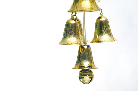 Gold christmas jingle bells. Isolated on a white background.