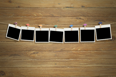 Blank photos over Wood background