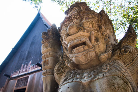 Stone sculpture in Bali style on entrance doorの写真素材