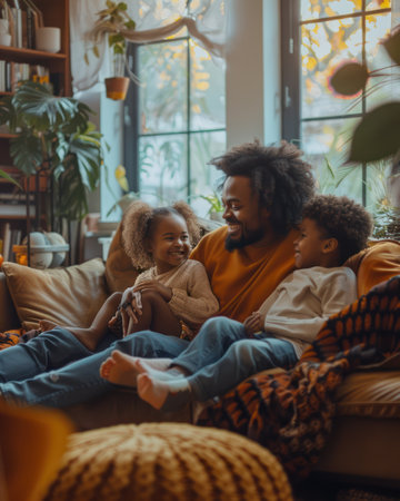 Medium shot of a Black family expressing joy and warmth in a cozy home, happiness, familial love, welcoming and comfortable interior, joyful interactions, close-knit family bonds.の素材