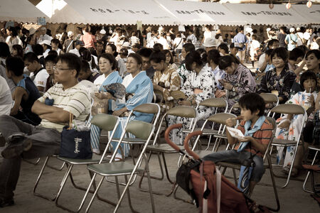 Some Japanese waiting for a show in Summer festivalのeditorial素材