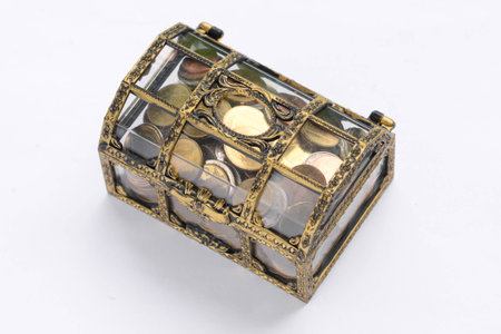 chest with gold coins. isolated on a white background.の写真素材