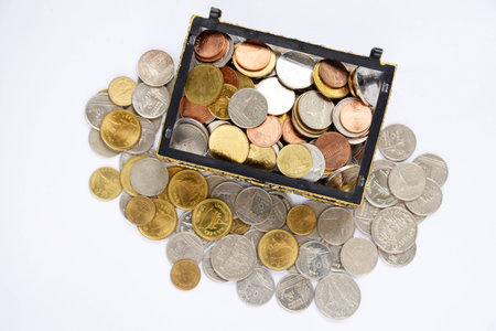 chest with gold coins. isolated on a white background.の写真素材