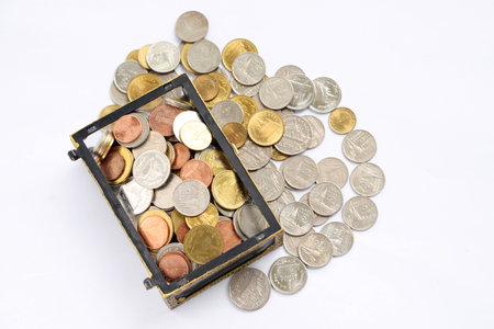 chest with gold coins. isolated on a white background.の写真素材