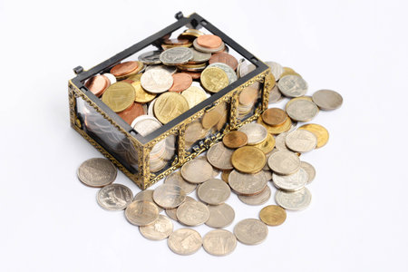 chest with gold coins. isolated on a white background.の写真素材