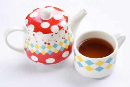 Teapot, cup of tea isolated on whiteの写真素材