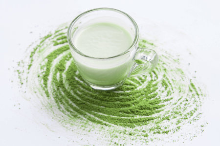 A Cup of Green Tea Latte with green tea powderの写真素材