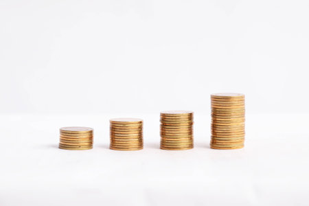 coins stacked up, on white background