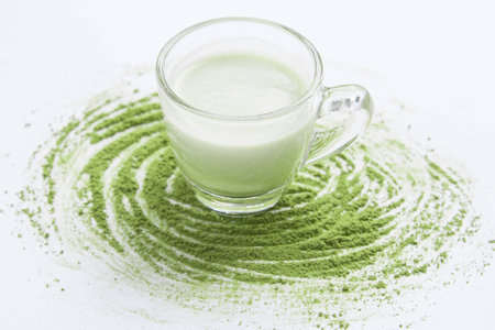 A Cup of Green Tea Latte with green tea powderの写真素材