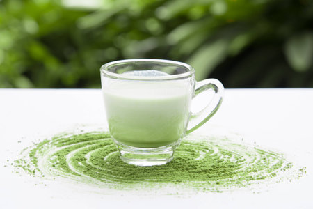 A Cup of Green Tea Latte with green tea powderの写真素材
