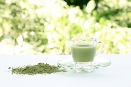 A Cup of Green Tea Latte with green tea powderの写真素材
