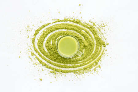 A Cup of Green Tea Latte with green tea powderの写真素材