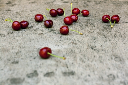 Red sweet cherry on old wooden table selective focusの写真素材