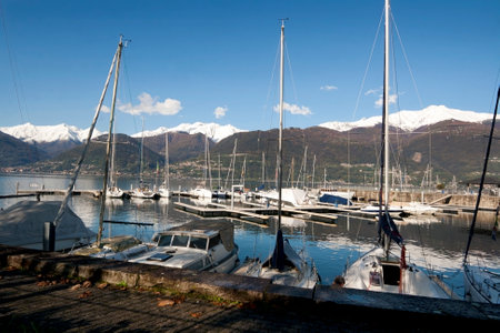 COLICO, ITALY, November 09, 2019 Colico panoramic view with ships and mountains on back , Lake Como, Northern Italy, Europeのeditorial素材