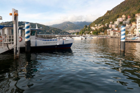COMO, LOMBARDY, ITALY, November 06, 2019, Local pier for public navigation in a bay of Como city on Lake Como, Northern Italy, Europeのeditorial素材