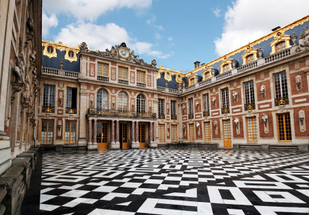 Main entrance of Versailles royal palace with ornate marble floor and decorative baroque fasade with columnsのeditorial素材