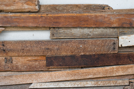 Brown wooden pallet on cement wallの写真素材