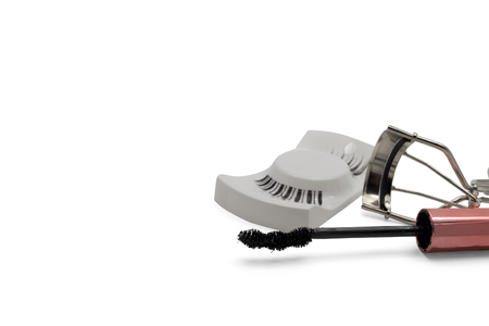 Mascara, fake eyelashes and eyelash curler isolated on white background with copy spaceの写真素材