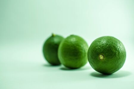 Three fresh lime isolated on white background