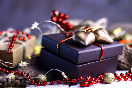 Gift boxes with golden hearts and decorative details.
