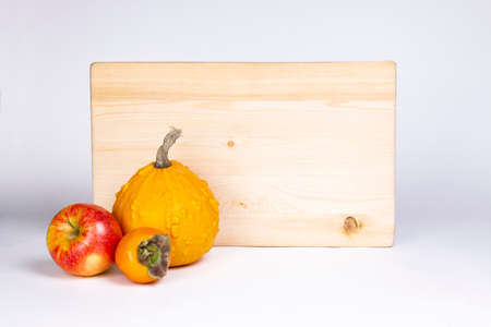 Apples and pumpkin with wooden signboard isolated on white background.の写真素材