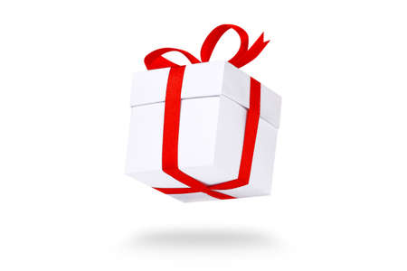 Flying white gift boxes on red background. Holiday gift concept. Part of set.の写真素材