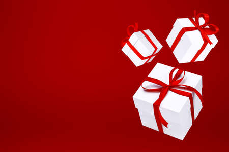 Flying white gift boxes on red background. Holiday gift concept. Part of set.